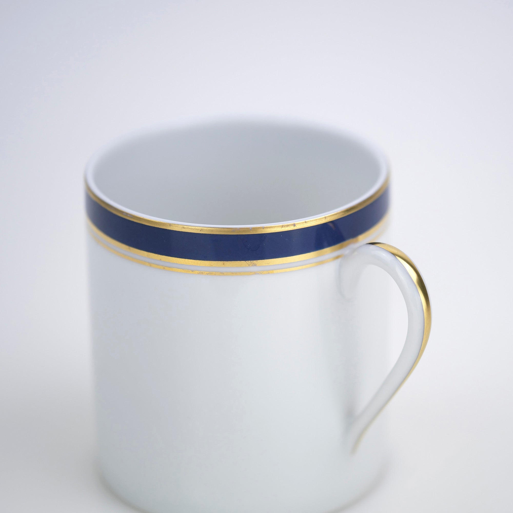 Raynaud Limoges Gold-plated navy blue demitasse cup and saucer