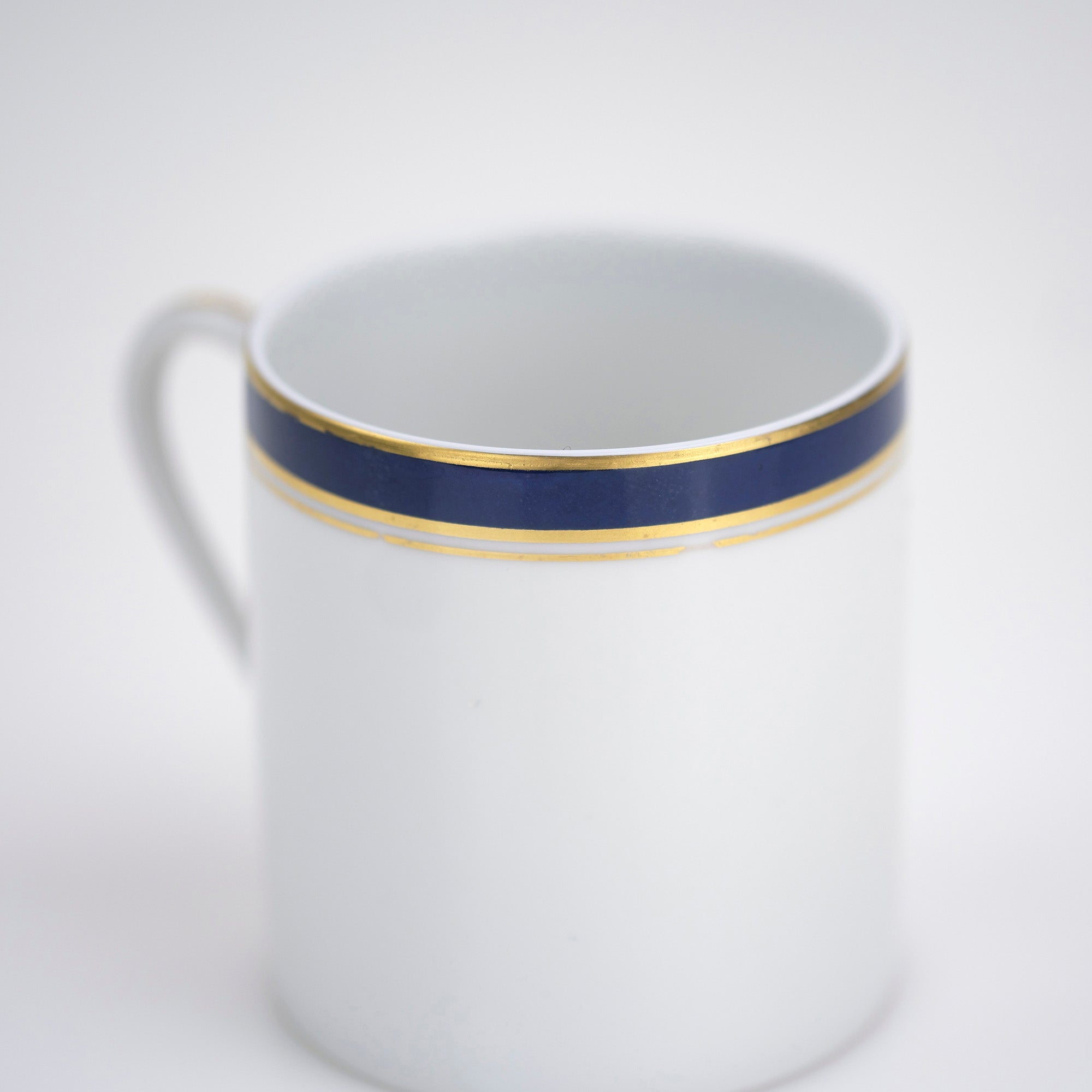 Raynaud Limoges Gold-plated navy blue demitasse cup and saucer