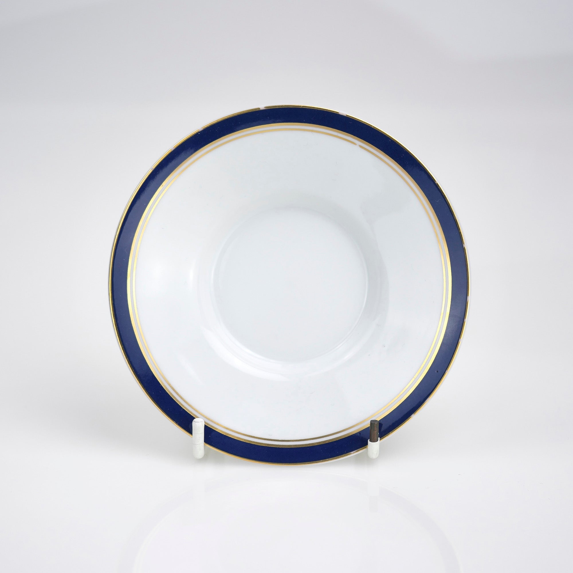Raynaud Limoges Gold-plated navy blue demitasse cup and saucer