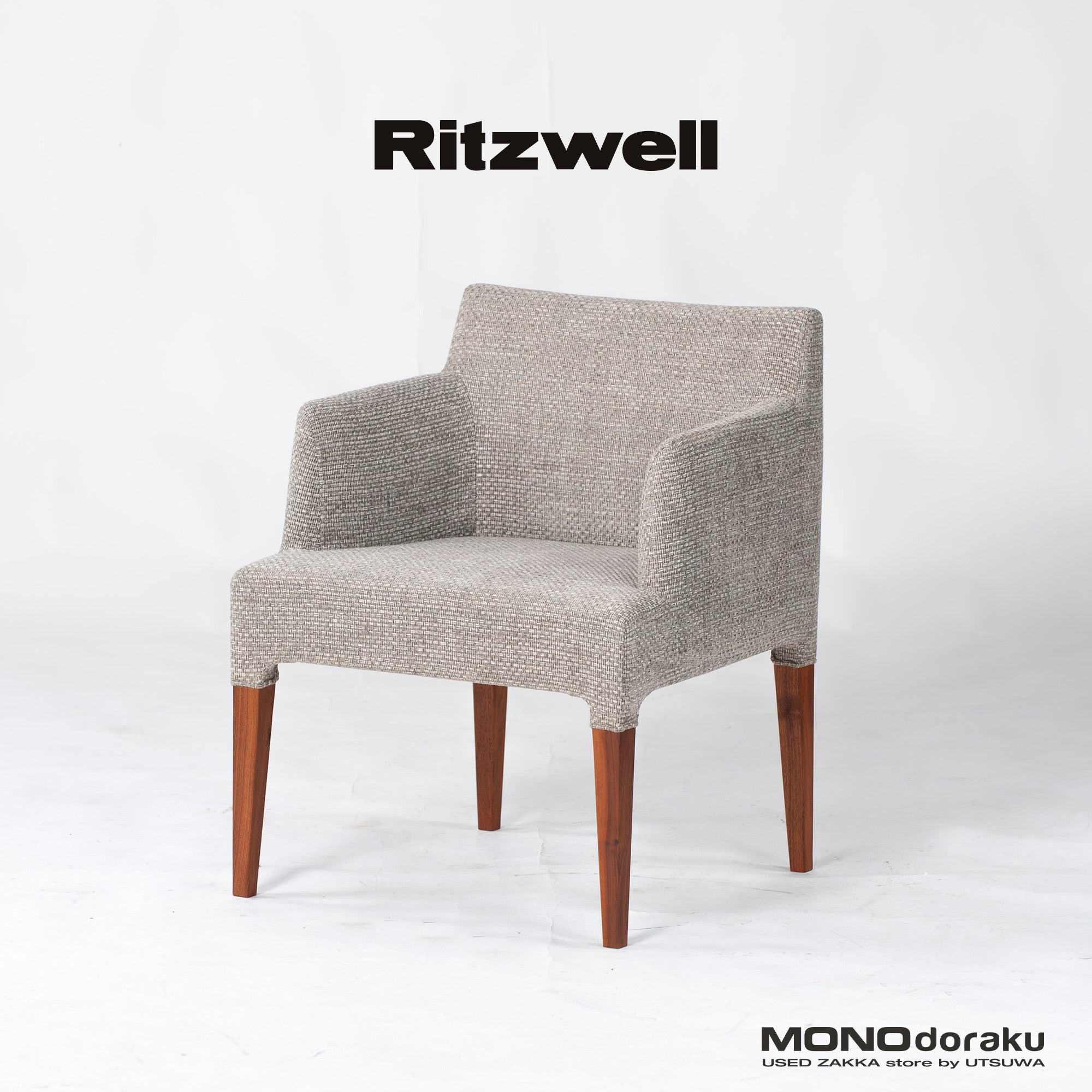 Ritzwell C-LINE armchair in walnut with an oil finish and fabric upholstery. Simple, Scandinavian modern design.