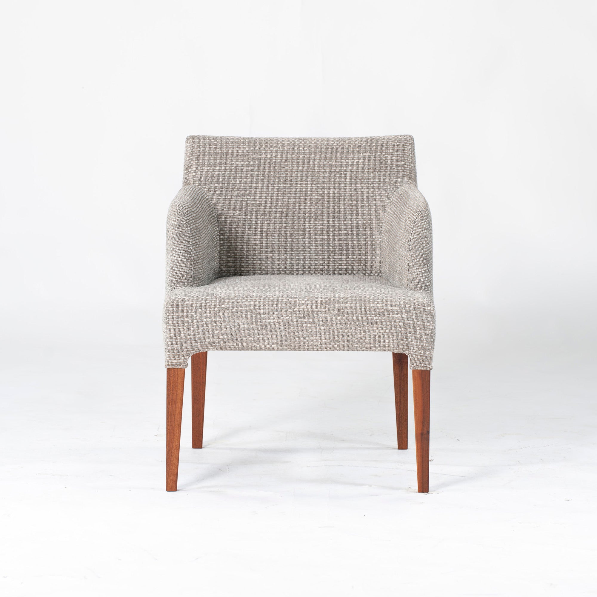 Ritzwell C-LINE armchair in walnut with an oil finish and fabric upholstery. Simple, Scandinavian modern design.