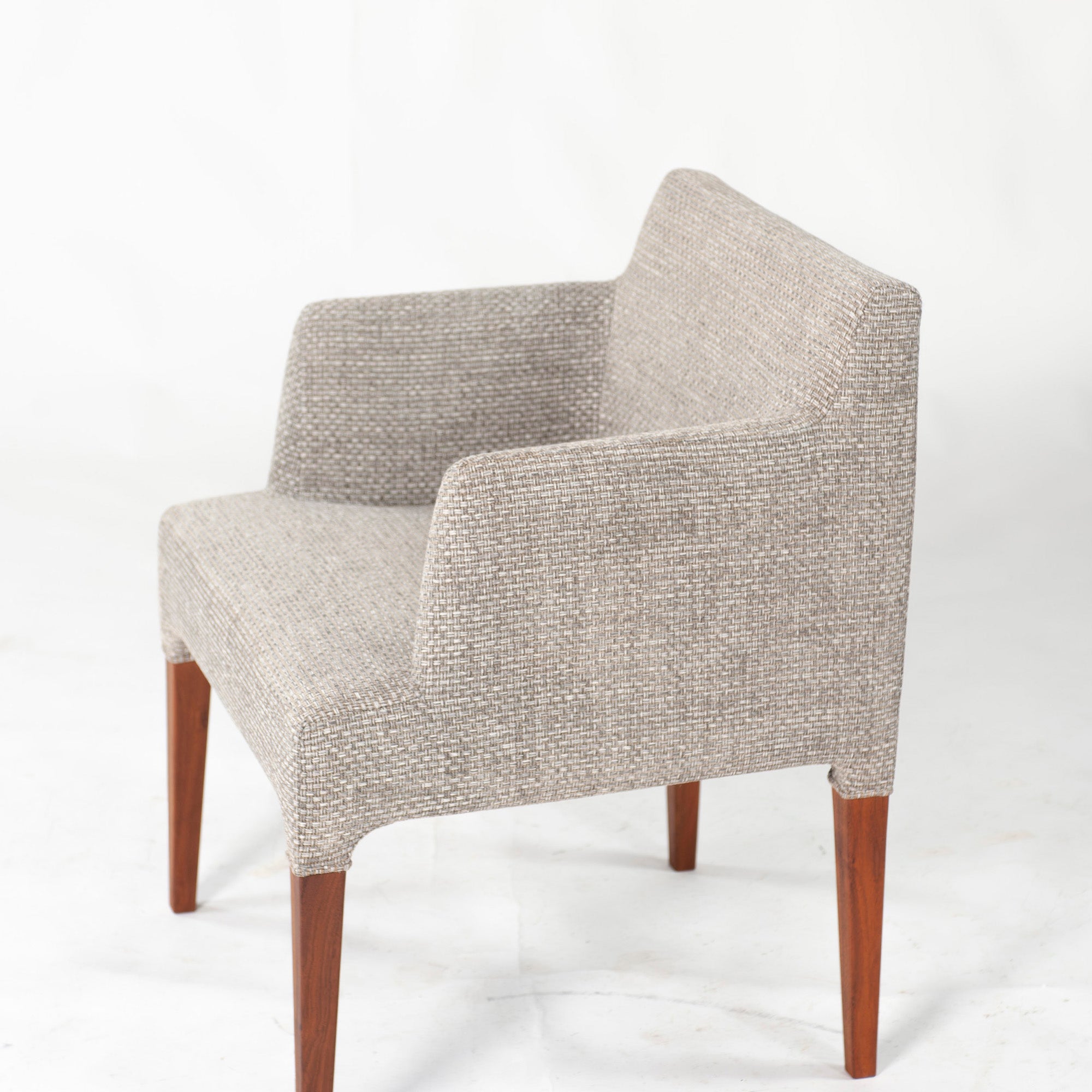 Ritzwell C-LINE armchair in walnut with an oil finish and fabric upholstery. Simple, Scandinavian modern design.