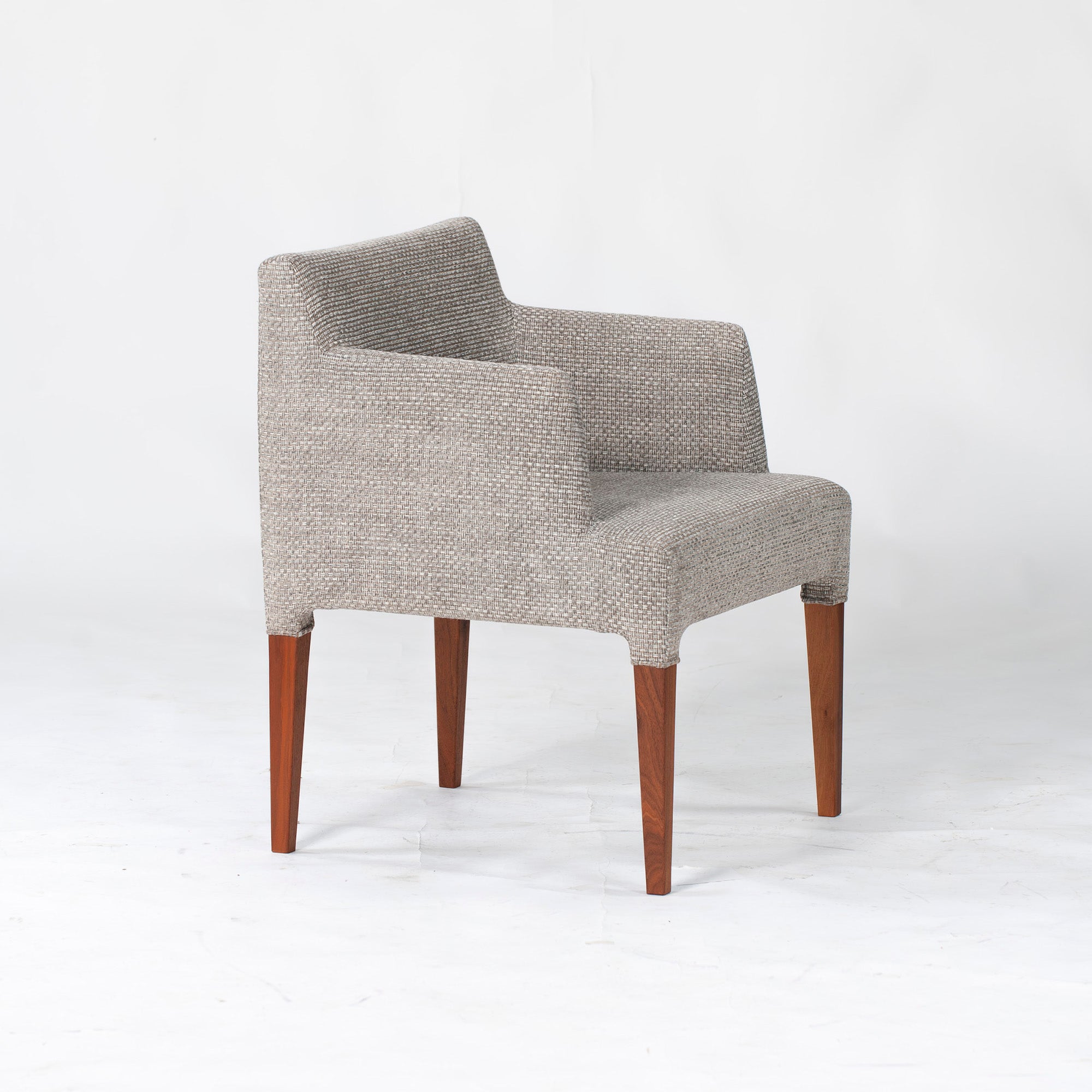 Ritzwell C-LINE armchair in walnut with an oil finish and fabric upholstery. Simple, Scandinavian modern design.