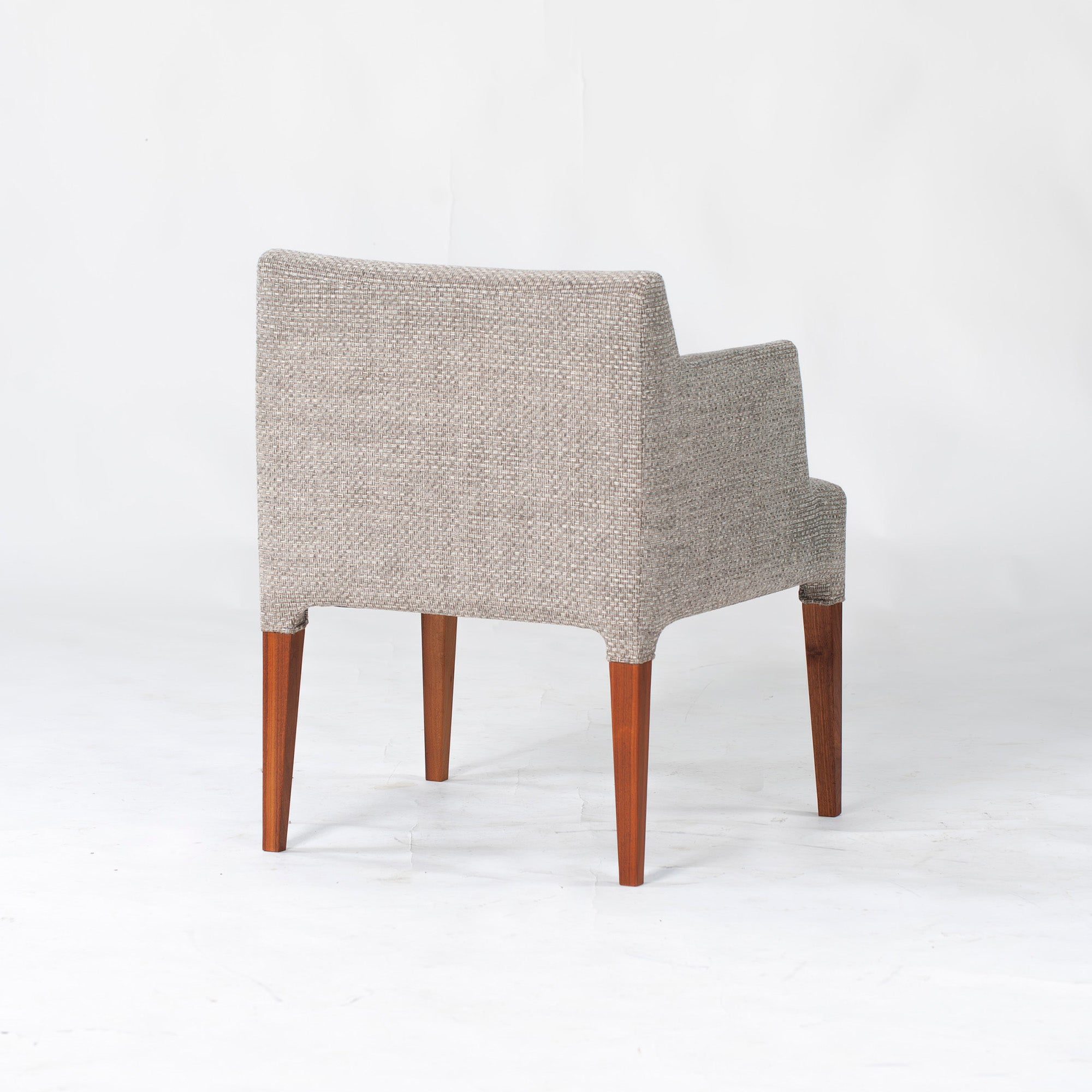 Ritzwell C-LINE armchair in walnut with an oil finish and fabric upholstery. Simple, Scandinavian modern design.