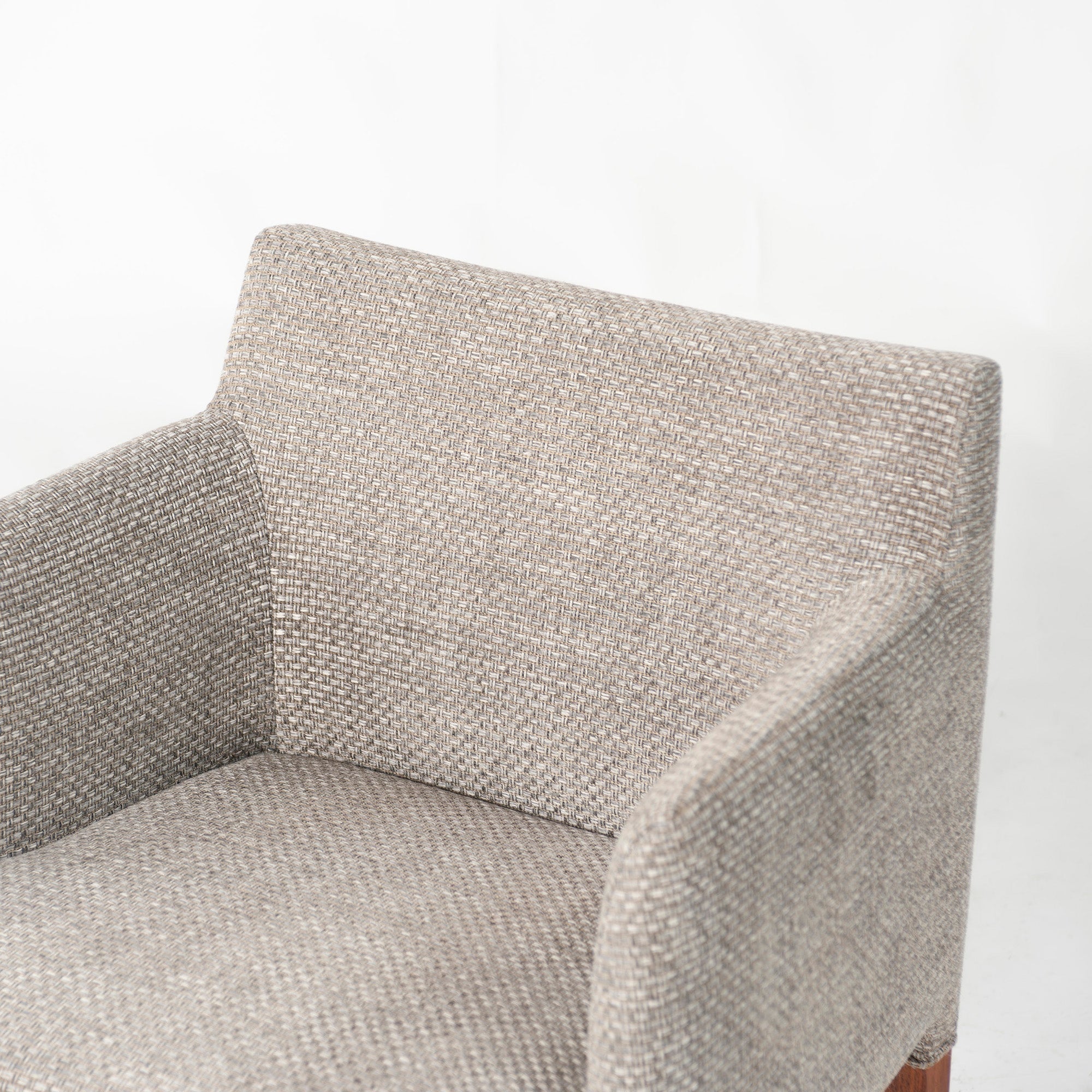 Ritzwell C-LINE armchair in walnut with an oil finish and fabric upholstery. Simple, Scandinavian modern design.