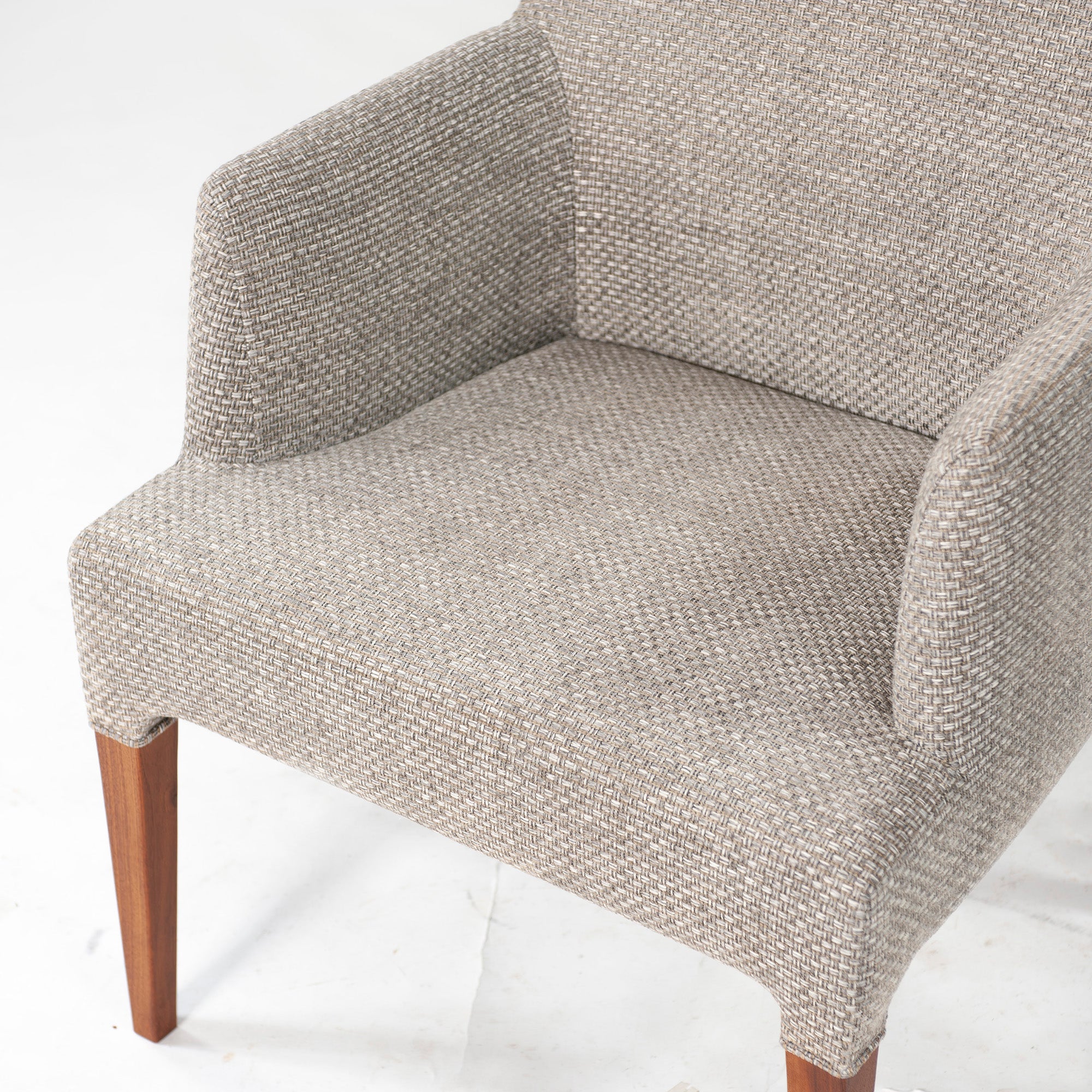 Ritzwell C-LINE armchair in walnut with an oil finish and fabric upholstery. Simple, Scandinavian modern design.