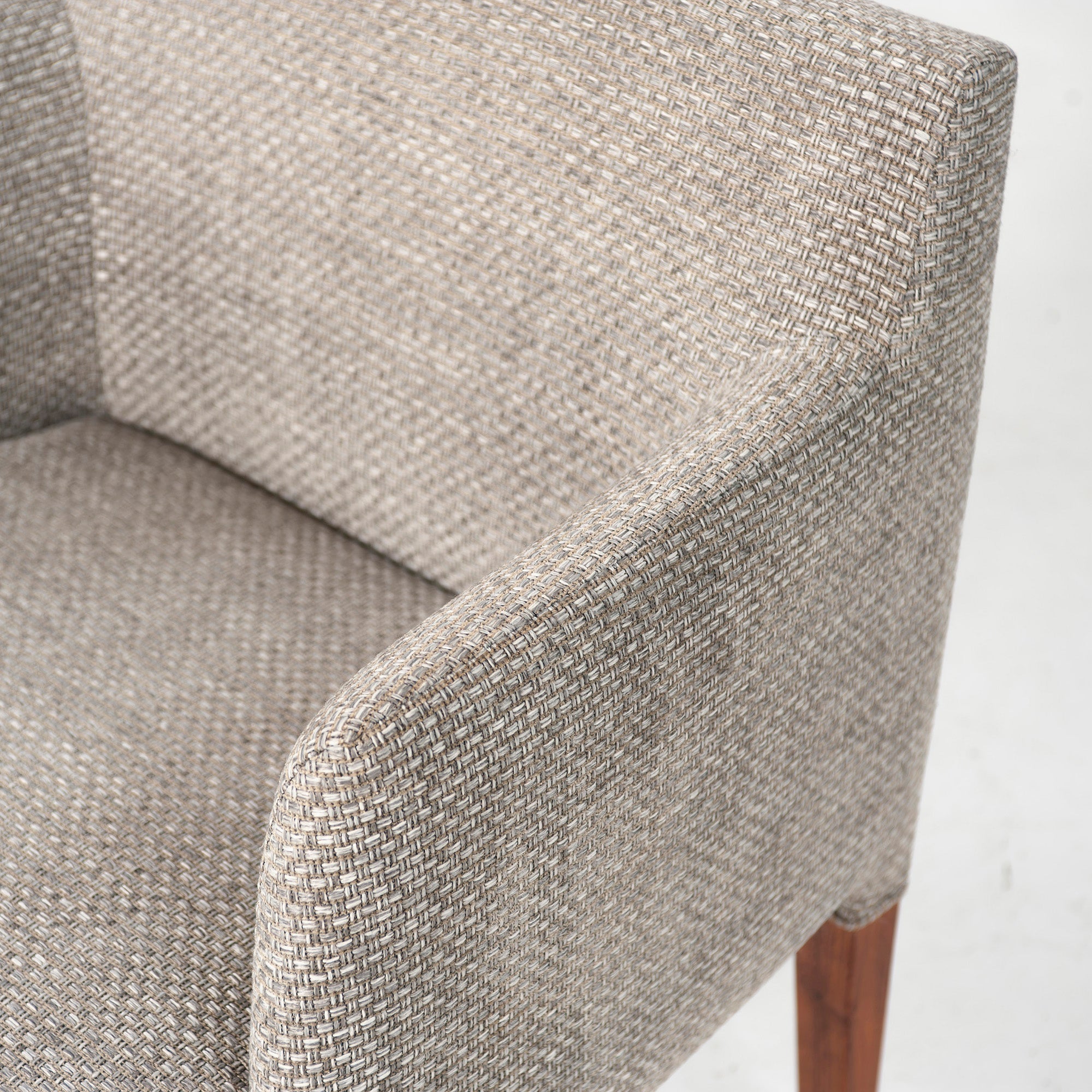 Ritzwell C-LINE armchair in walnut with an oil finish and fabric upholstery. Simple, Scandinavian modern design.