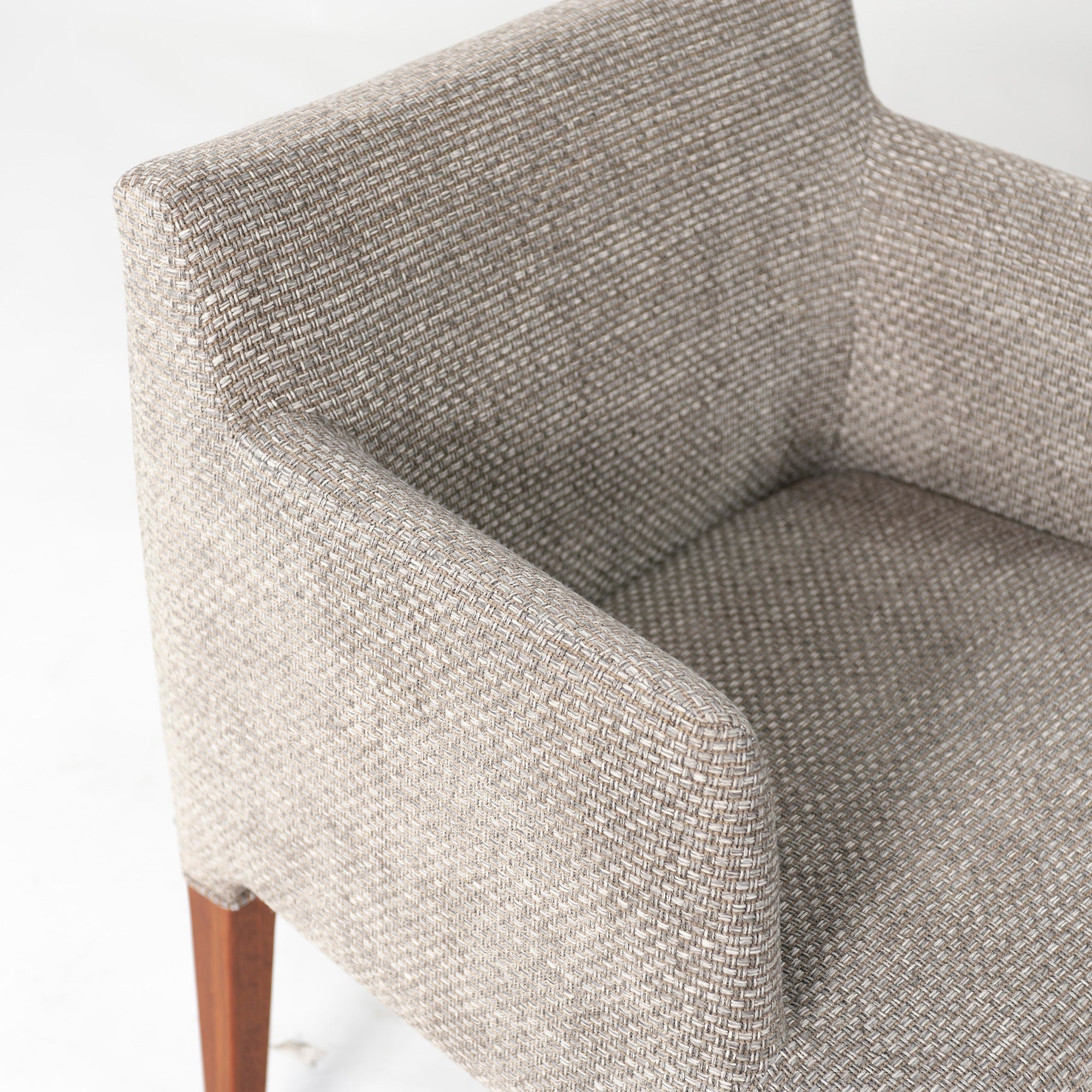 Ritzwell C-LINE armchair in walnut with an oil finish and fabric upholstery. Simple, Scandinavian modern design.