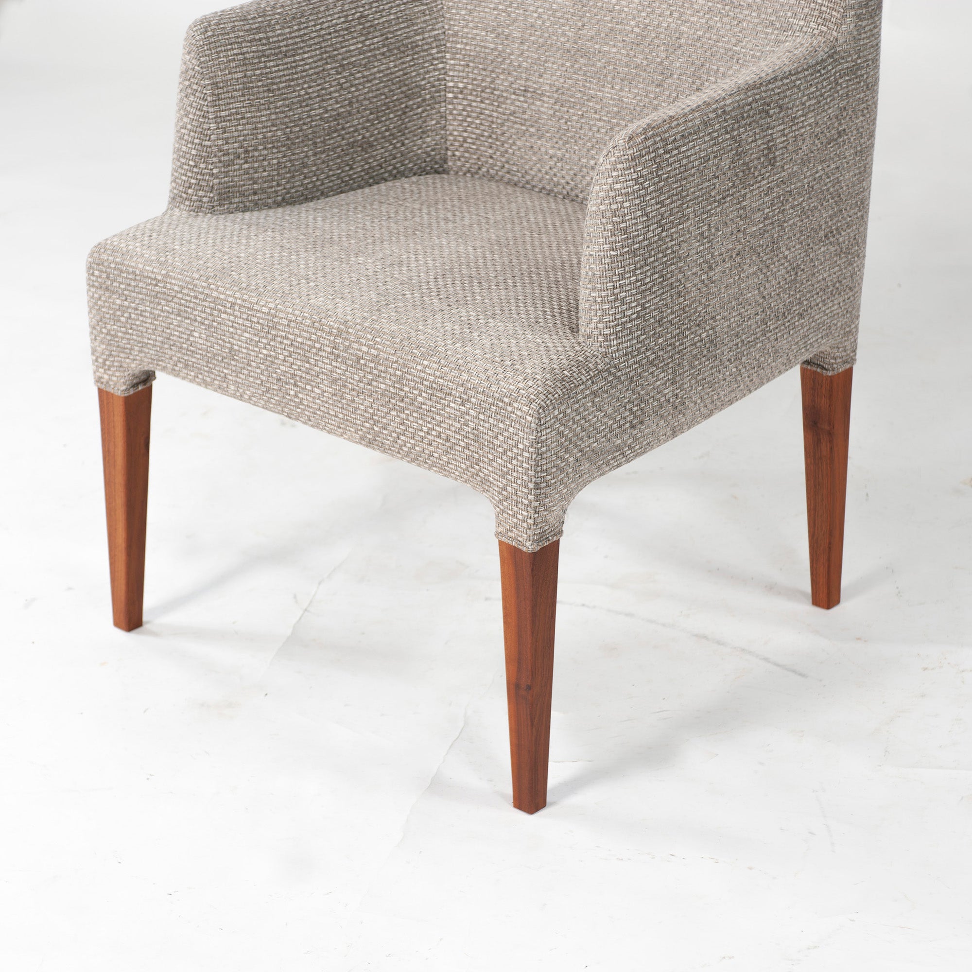 Ritzwell C-LINE armchair in walnut with an oil finish and fabric upholstery. Simple, Scandinavian modern design.