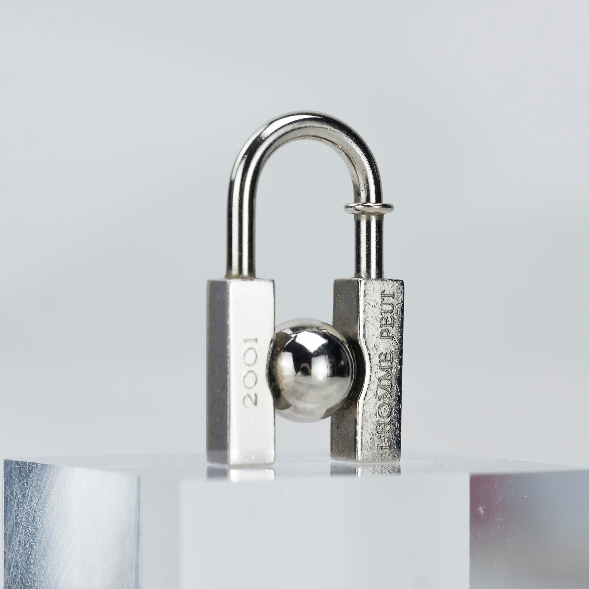 HERMES Padlock Charm 2001 Limited Edition "L'HOMME PEUT EMBELLIR LA TERRE/In Search of the Unknown Beauty of the Earth"