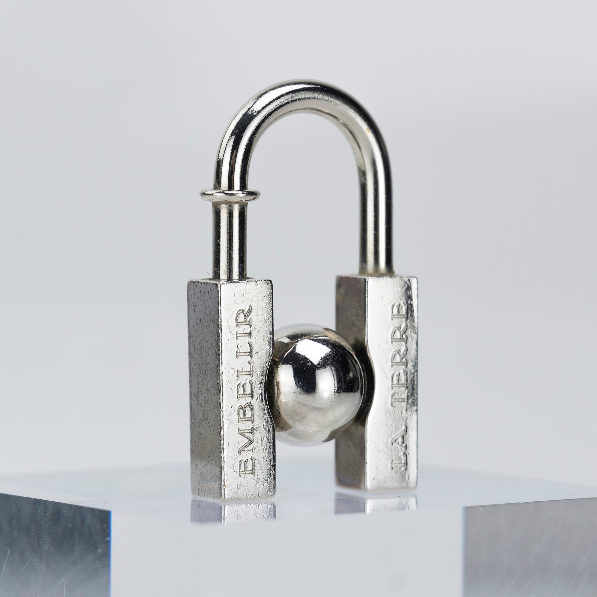 HERMES Padlock Charm 2001 Limited Edition "L'HOMME PEUT EMBELLIR LA TERRE/In Search of the Unknown Beauty of the Earth"