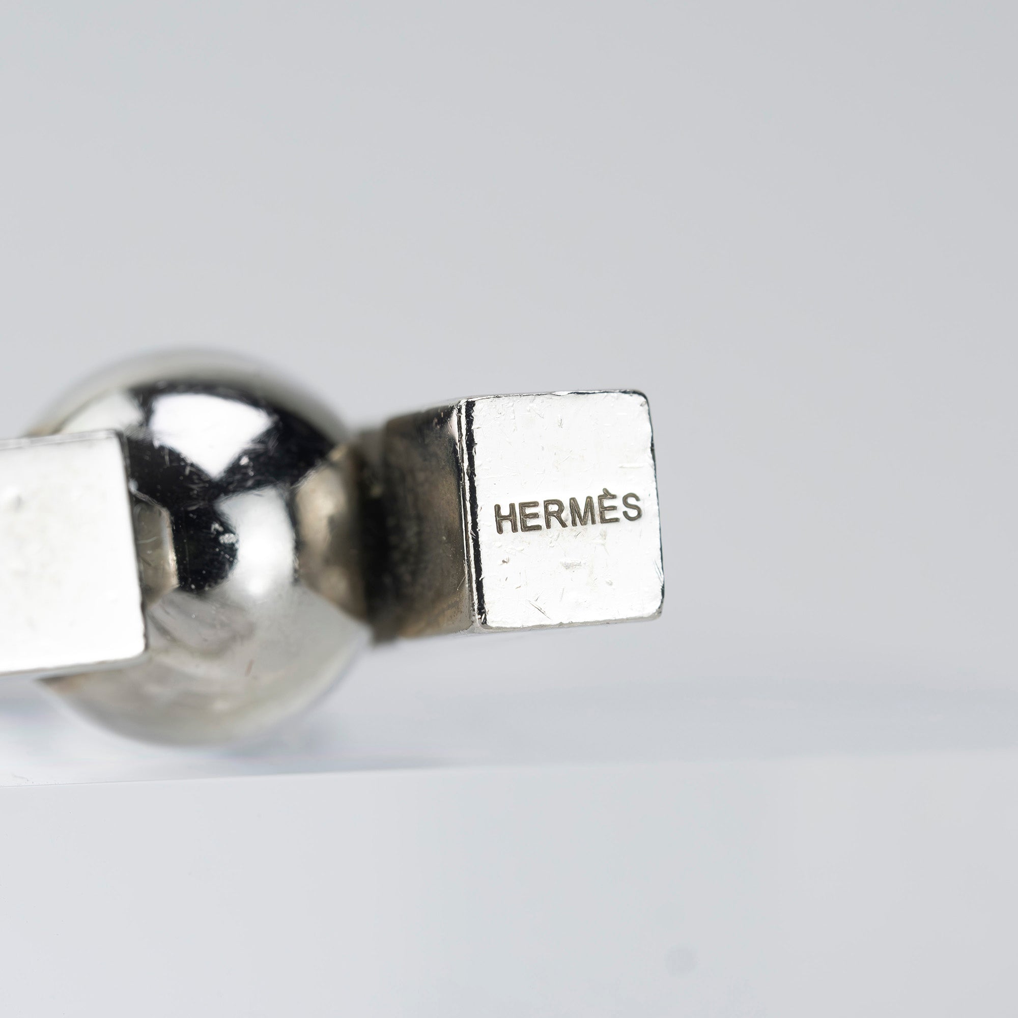 HERMES Padlock Charm 2001 Limited Edition "L'HOMME PEUT EMBELLIR LA TERRE/In Search of the Unknown Beauty of the Earth"
