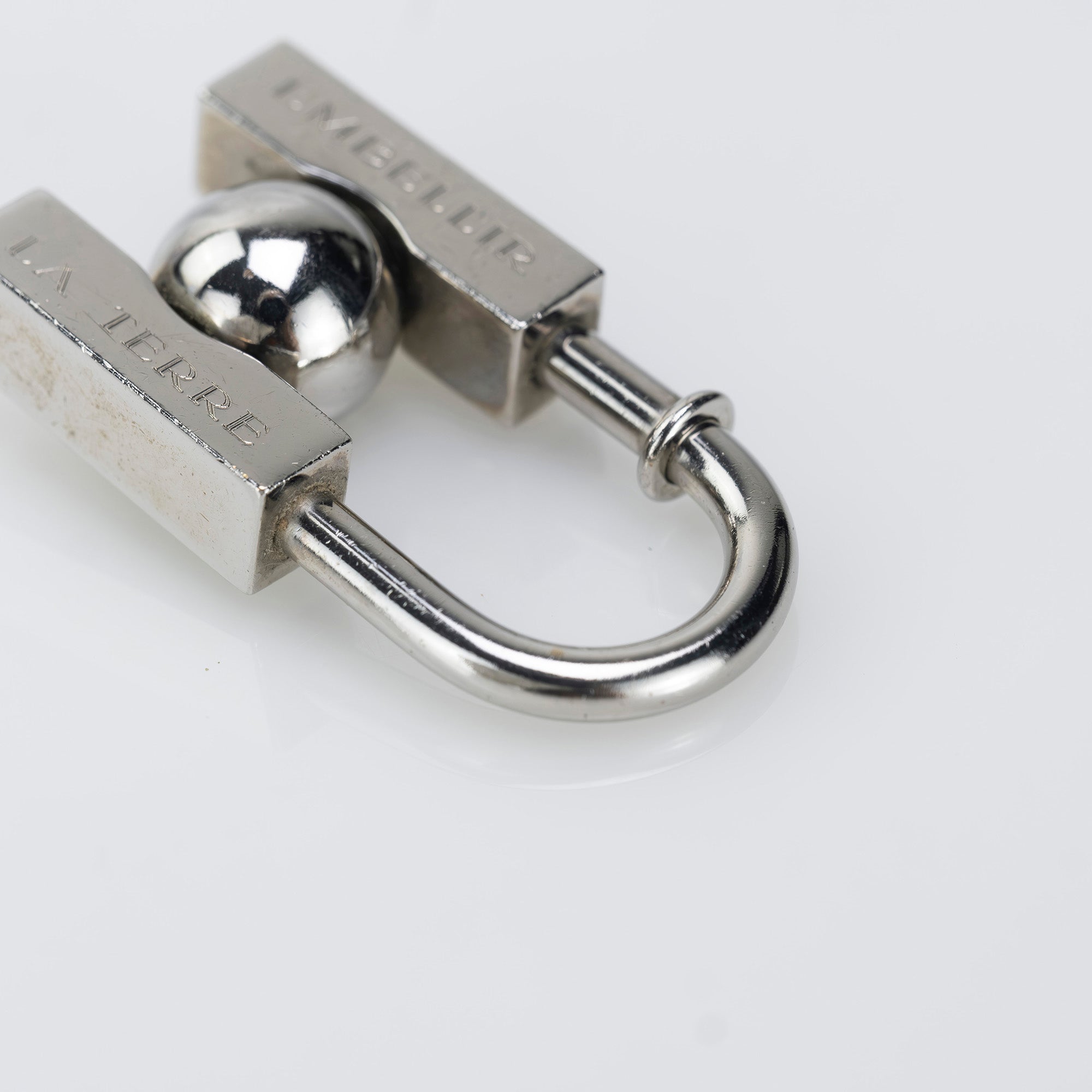 HERMES Padlock Charm 2001 Limited Edition "L'HOMME PEUT EMBELLIR LA TERRE/In Search of the Unknown Beauty of the Earth"