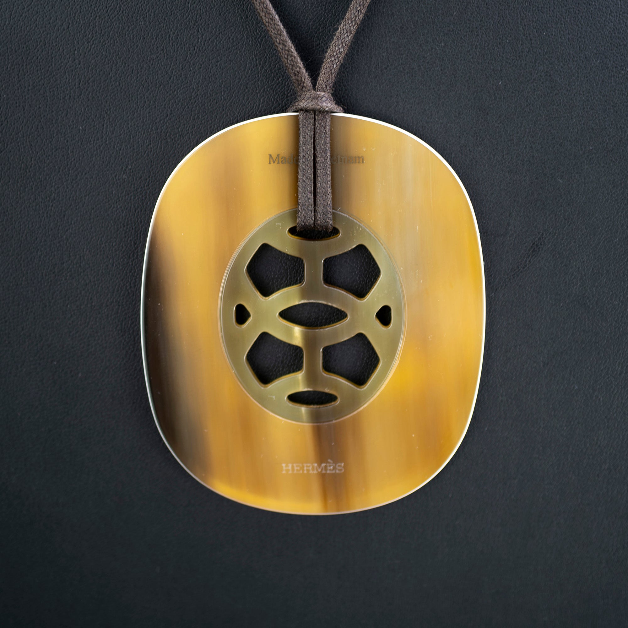 Hermès Lift pendant necklace in buffalo horn and lacquer on cotton cord