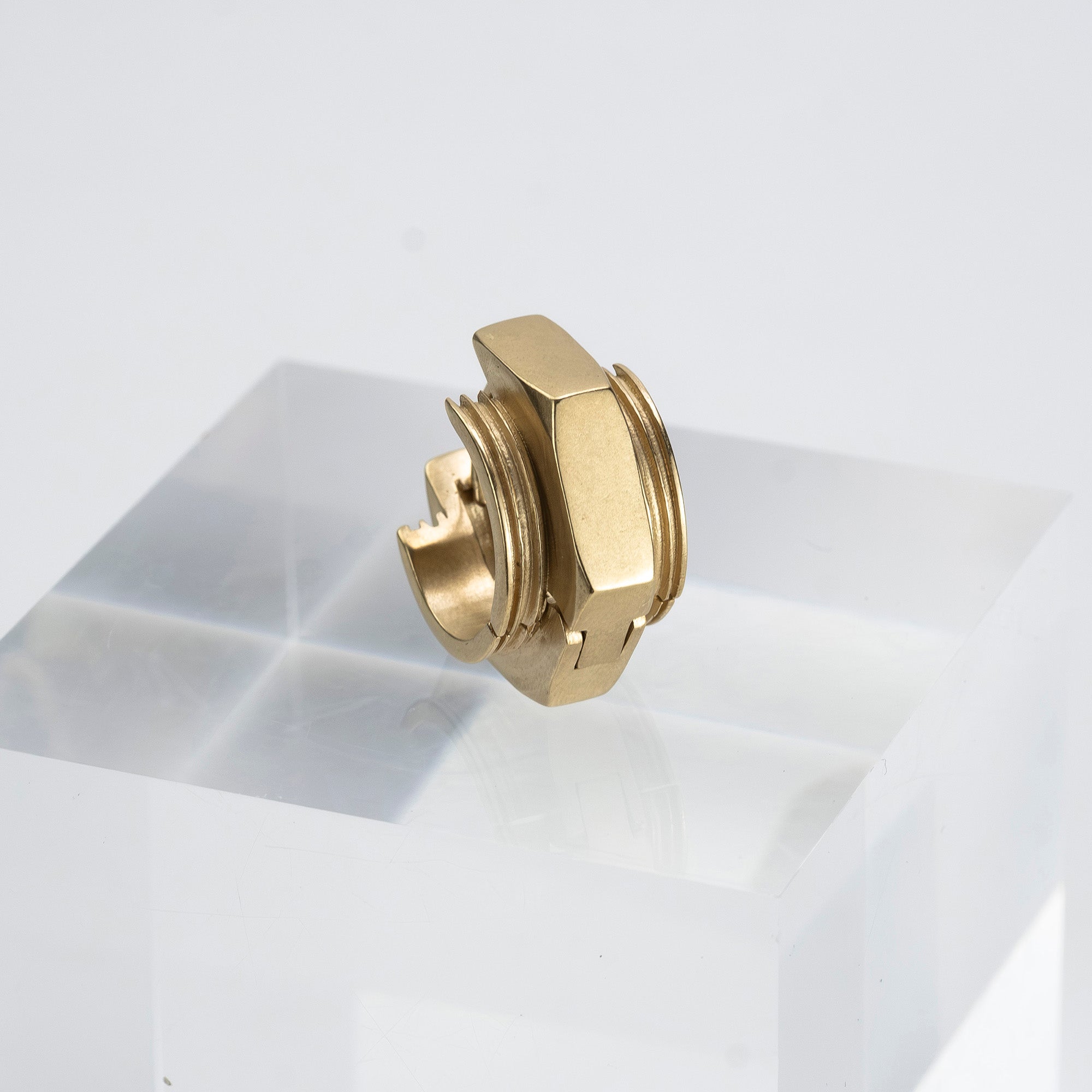 Maison Margiela single earring in 11k gold and brass with bolt motif