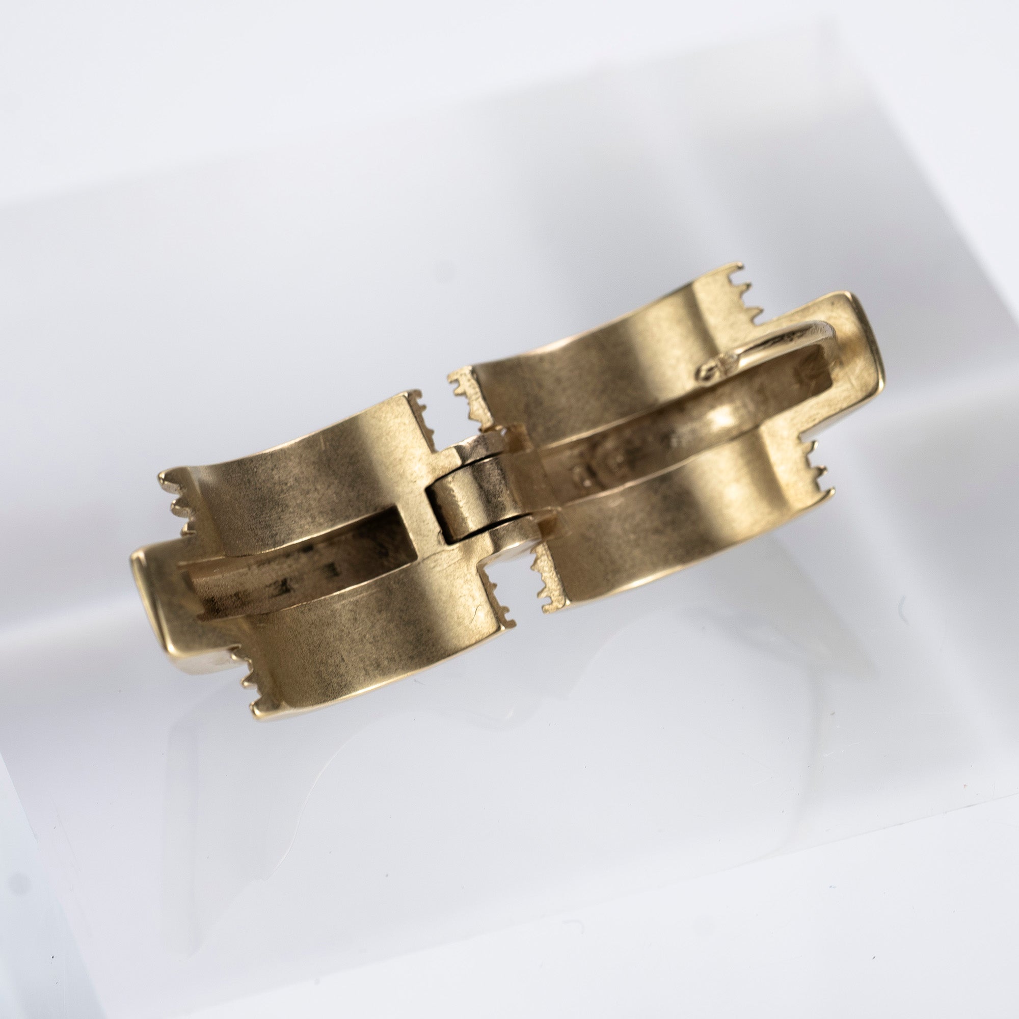 Maison Margiela single earring in 11k gold and brass with bolt motif