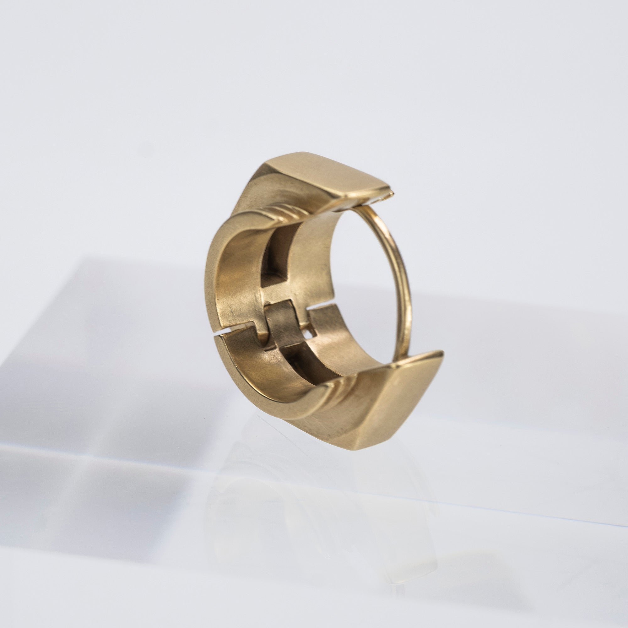 Maison Margiela single earring in 11k gold and brass with bolt motif