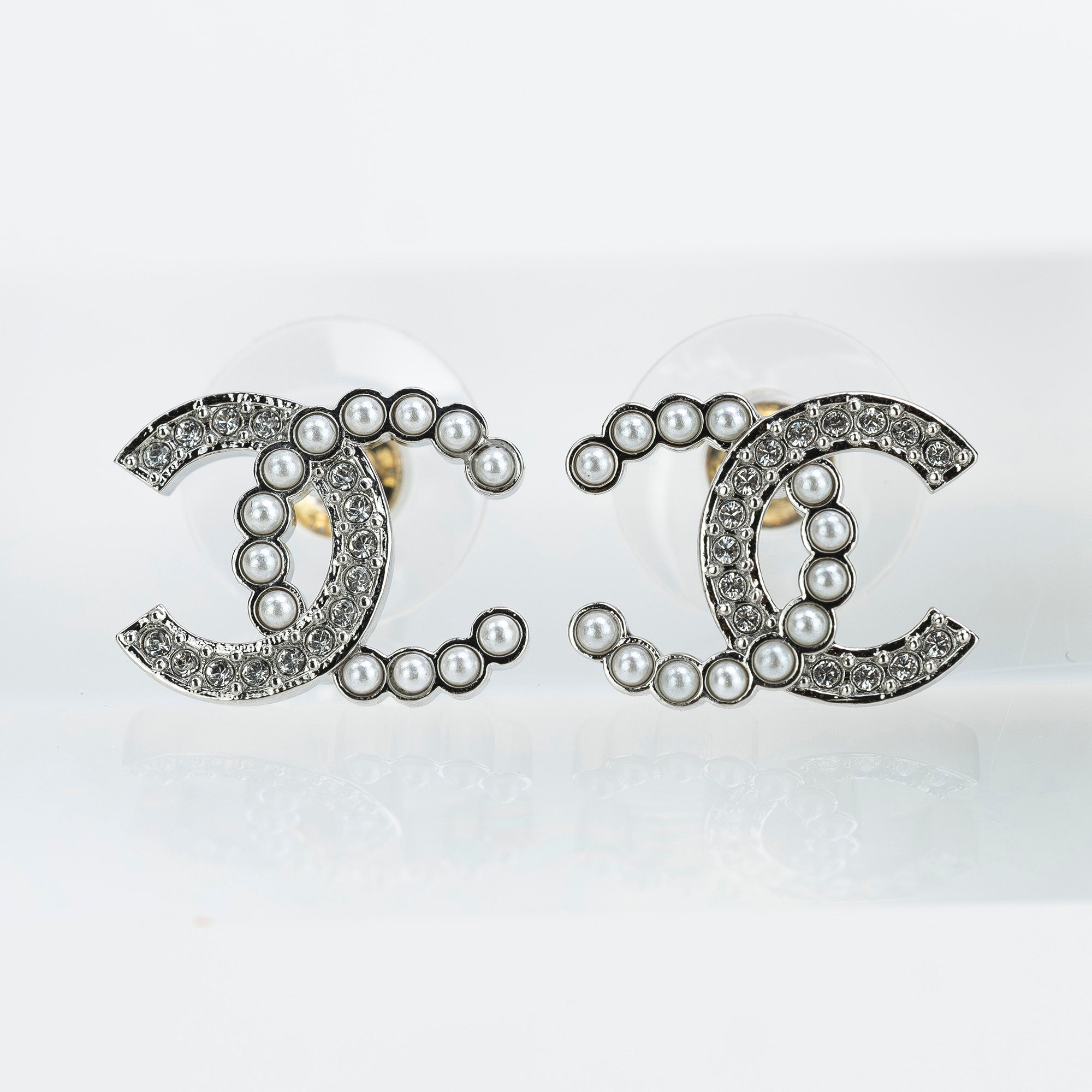 CHANEL Coco Mark earrings with pearls and rhinestones in silver with CC logo. Excellent condition. Comes with box, dust bag, and shopping bag.