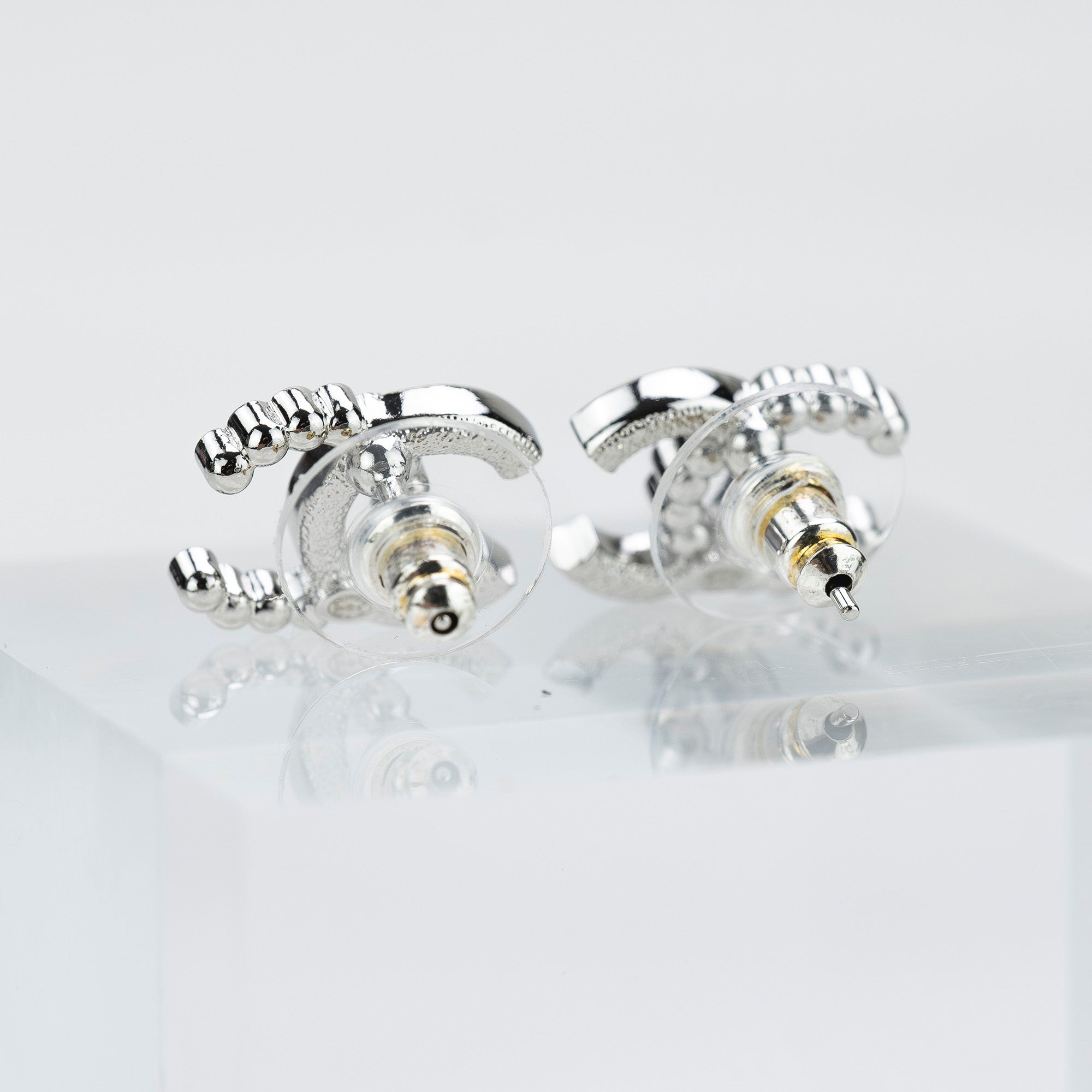 CHANEL Coco Mark earrings with pearls and rhinestones in silver with CC logo. Excellent condition. Comes with box, dust bag, and shopping bag.