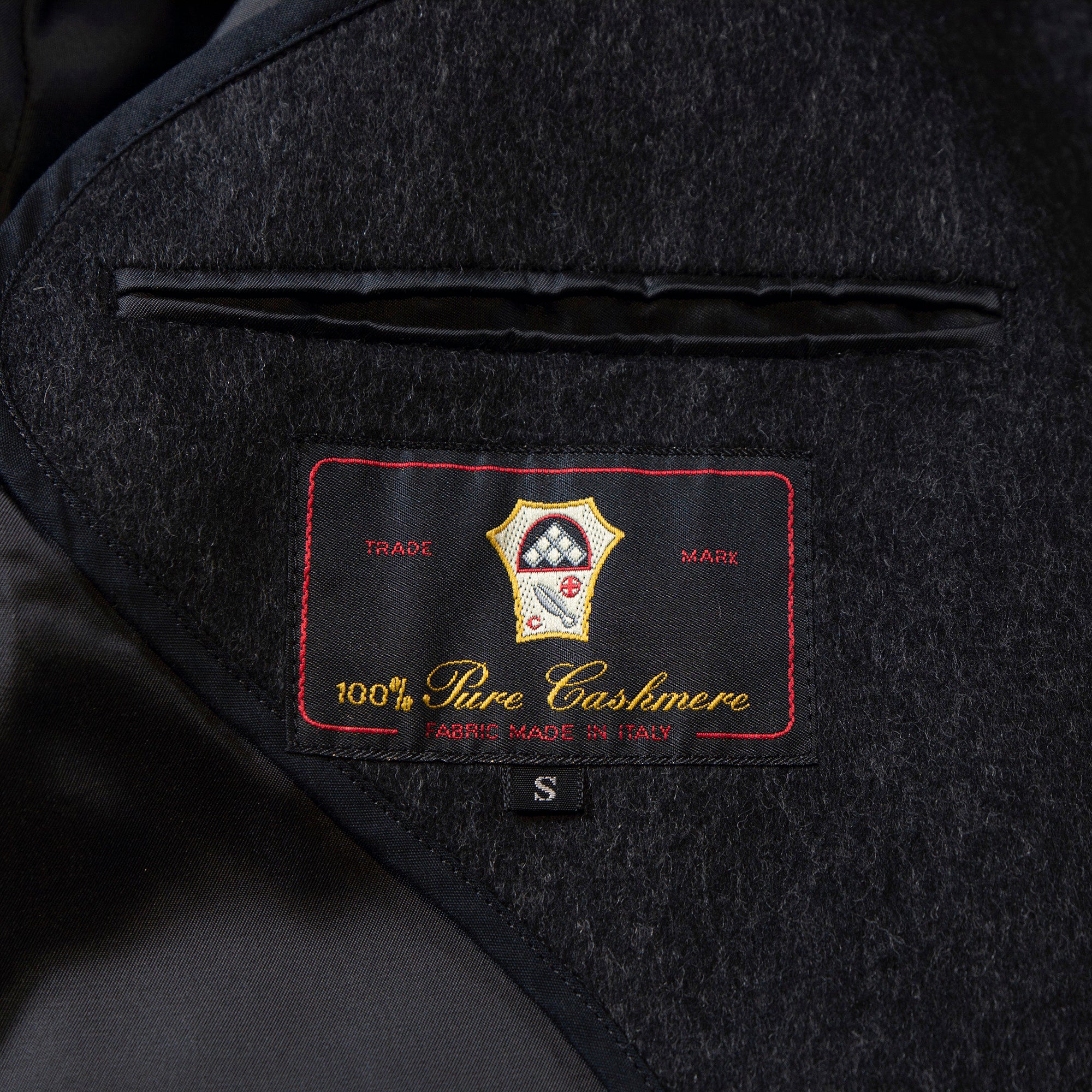 Pre-owned Italian pure cashmere Balmacaan coat in gray. Features a concealed placket, raglan sleeves, and a mid-length 100% cashmere lining. Men's fashion, outerwear, and coat.