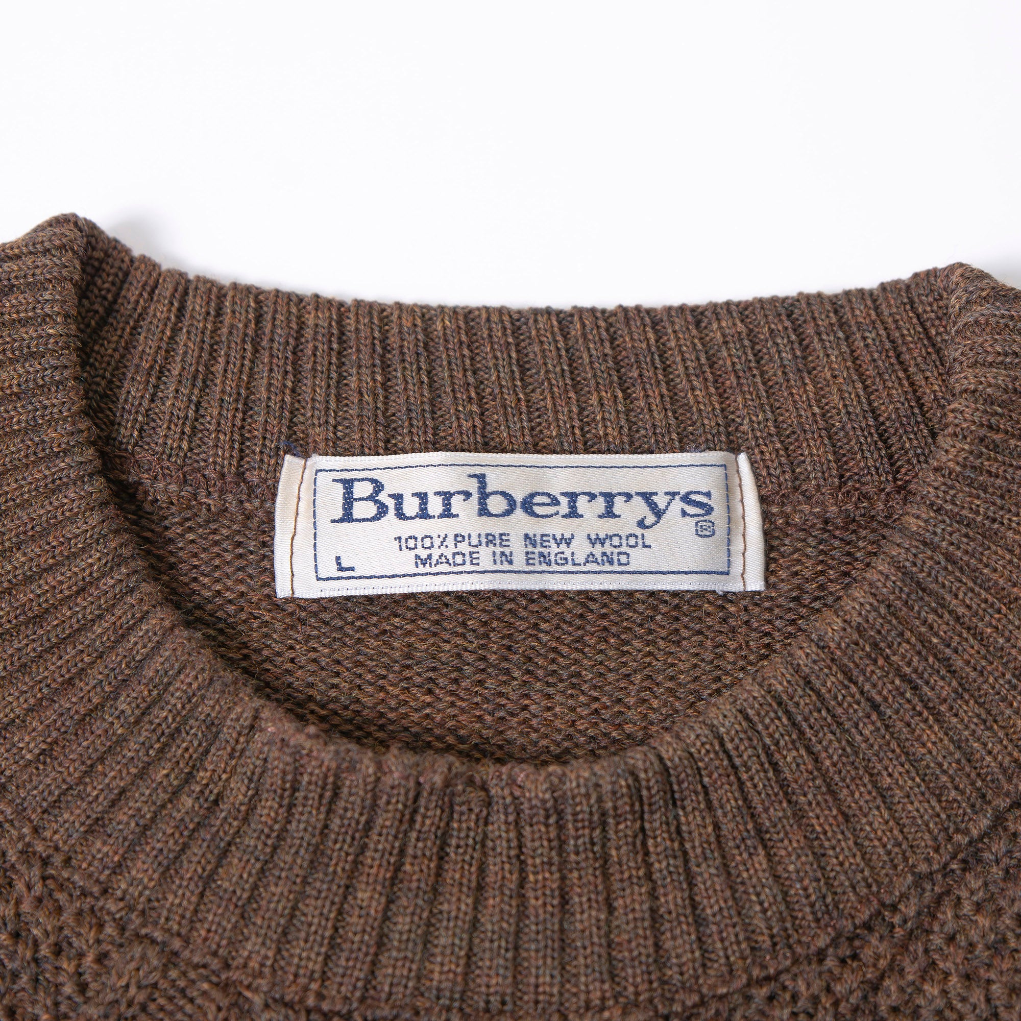 Burberry cable knit sweater with suede accents, shoulder and elbow patches, and an embroidered logo. Brown, size L. Made in England. Wool. 90s. Men's.