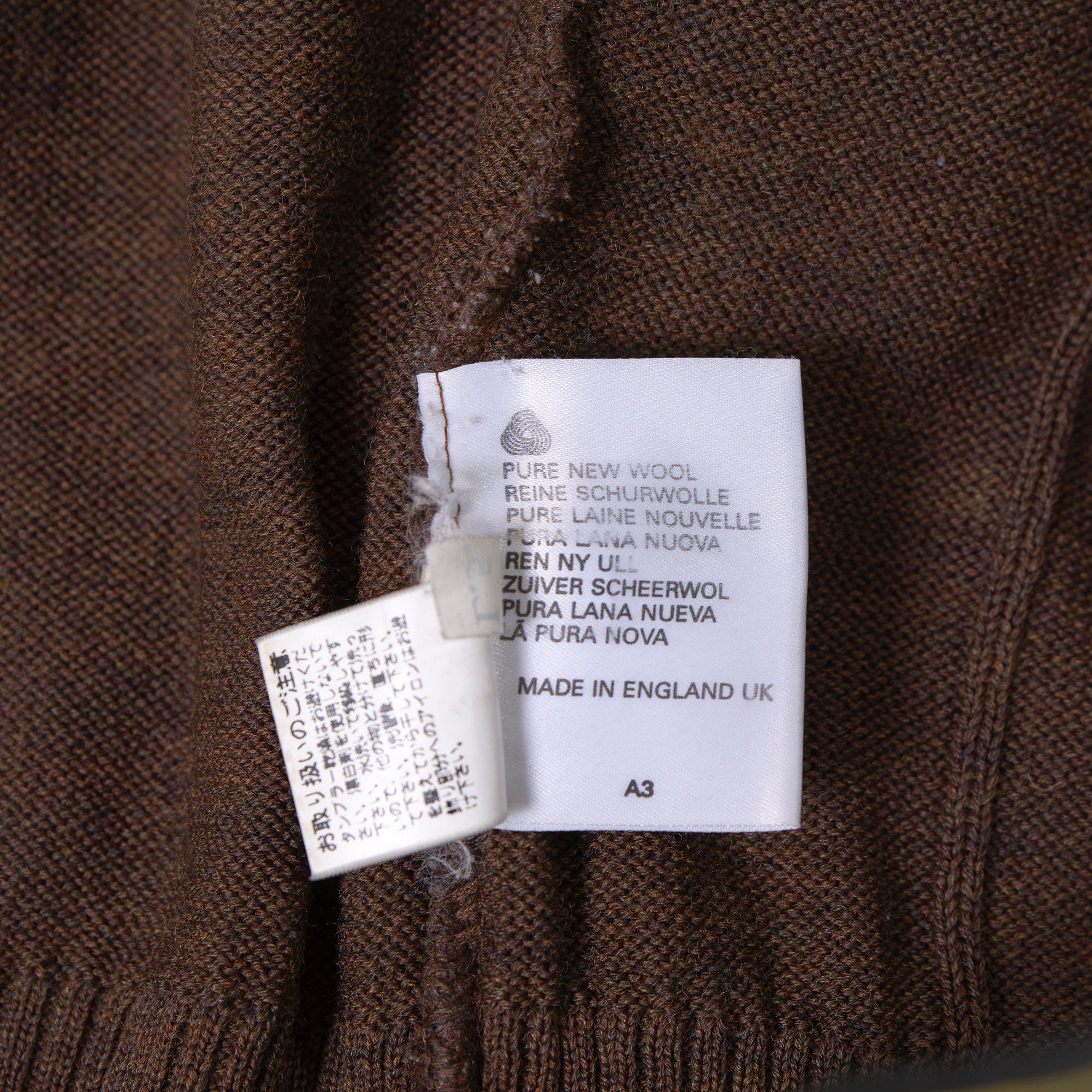 Burberry cable knit sweater with suede accents, shoulder and elbow patches, and an embroidered logo. Brown, size L. Made in England. Wool. 90s. Men's.