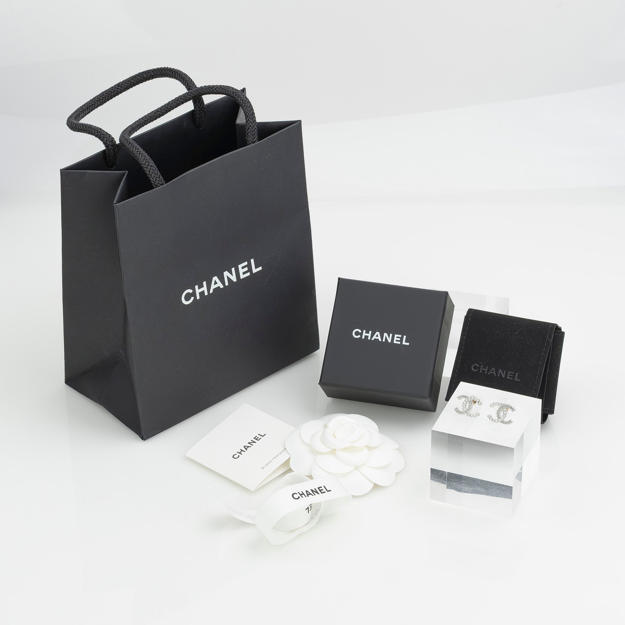 CHANEL Coco Mark earrings with pearls and rhinestones in silver with CC logo. Excellent condition. Comes with box, dust bag, and shopping bag.