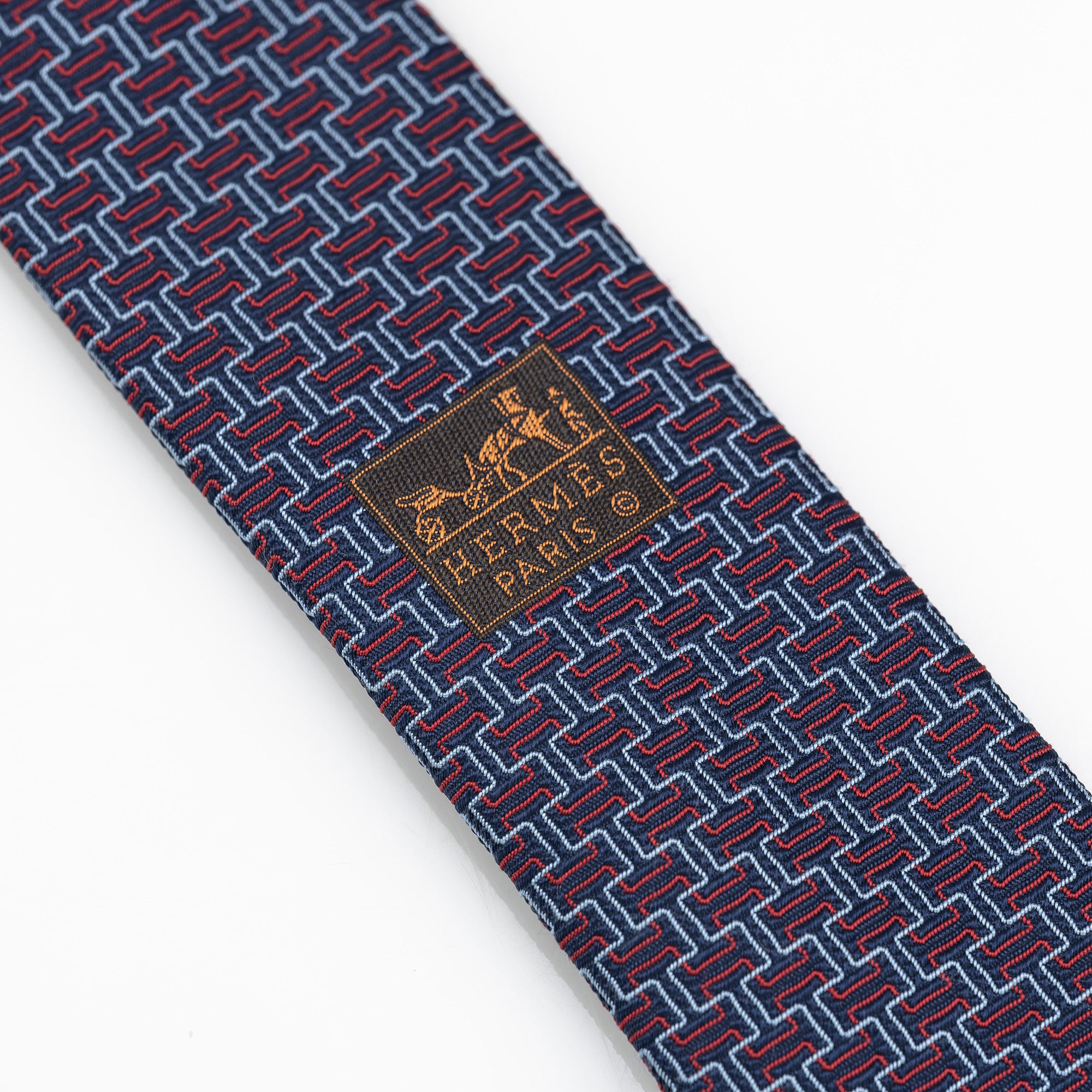 Hermes tie, H motif-inspired geometric pattern, 100% silk, navy x red, with box.