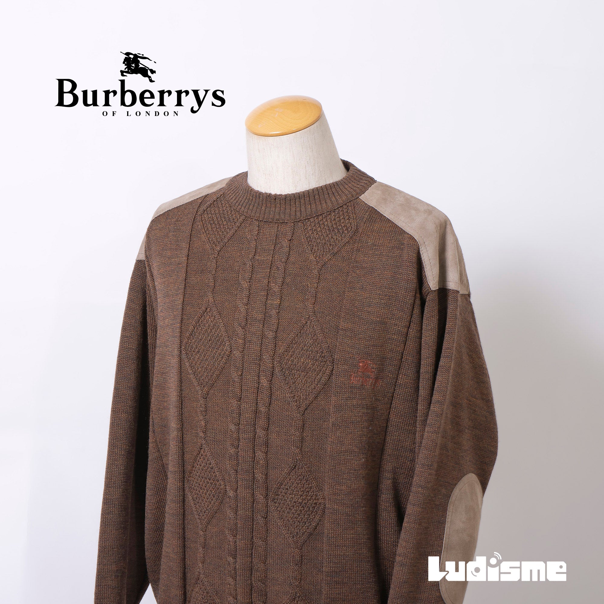 Burberry cable knit sweater with suede accents, shoulder and elbow patches, and an embroidered logo. Brown, size L. Made in England. Wool. 90s. Men's.
