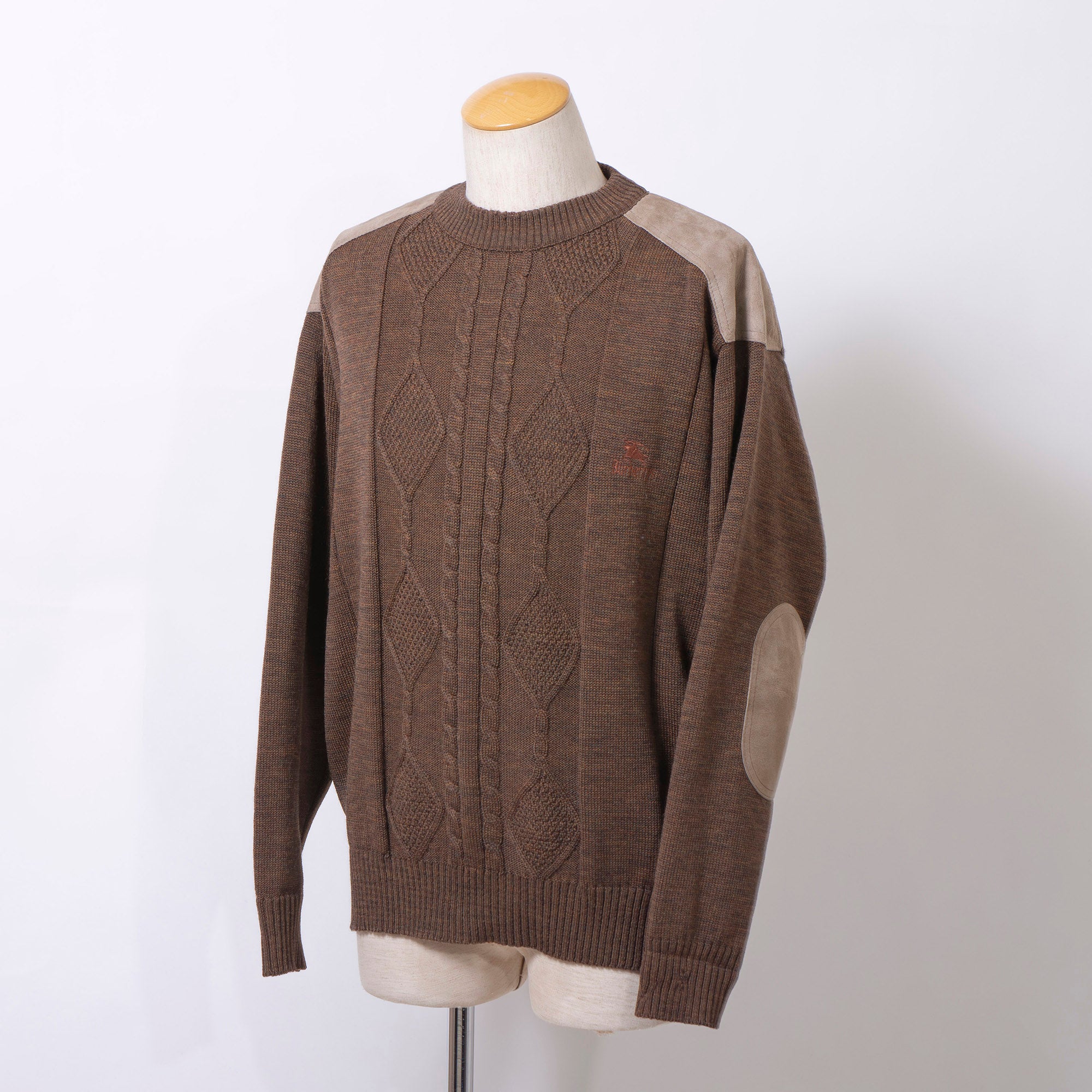 Burberry cable knit sweater with suede accents, shoulder and elbow patches, and an embroidered logo. Brown, size L. Made in England. Wool. 90s. Men's.